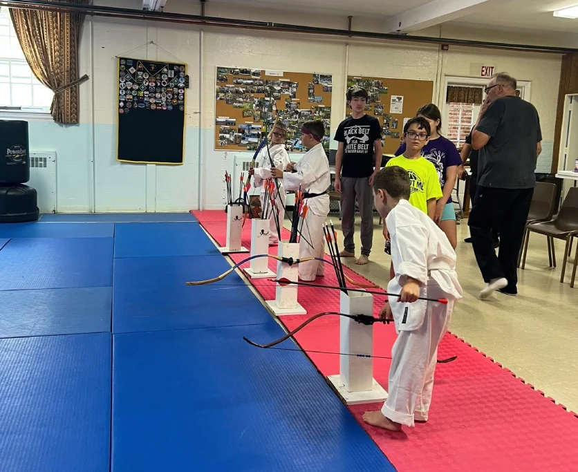 kids in Broomall martial arts class improving focus, discipline, and listening skills through martial arts training